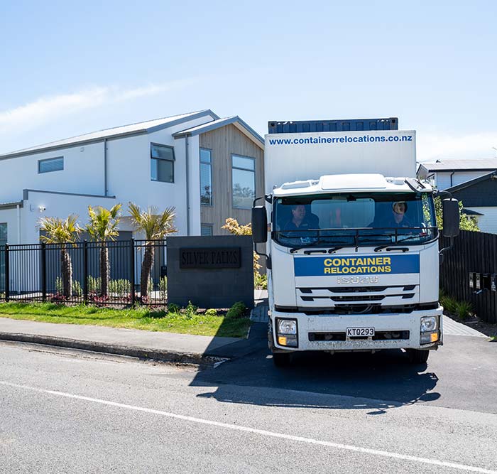 //christchurchrelocations.co.nz/wp-content/uploads/sites/4/2023/06/Truck-reversing-down-Marks-drive.jpg